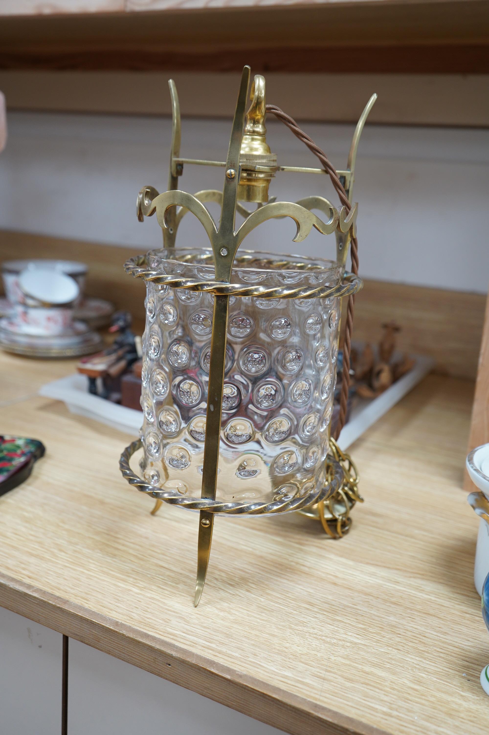 An English Art Nouveau brass lantern with wavy bubbly glass cylinder, c.1910-1920's, including chain and ceiling rose, wired, lantern 34cm high, diameter 13.5cm, glass 16.5cm high. Condition - glass shade a little loose